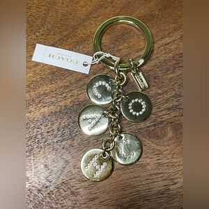 COACH Crystal Letters Disc Bag Charm